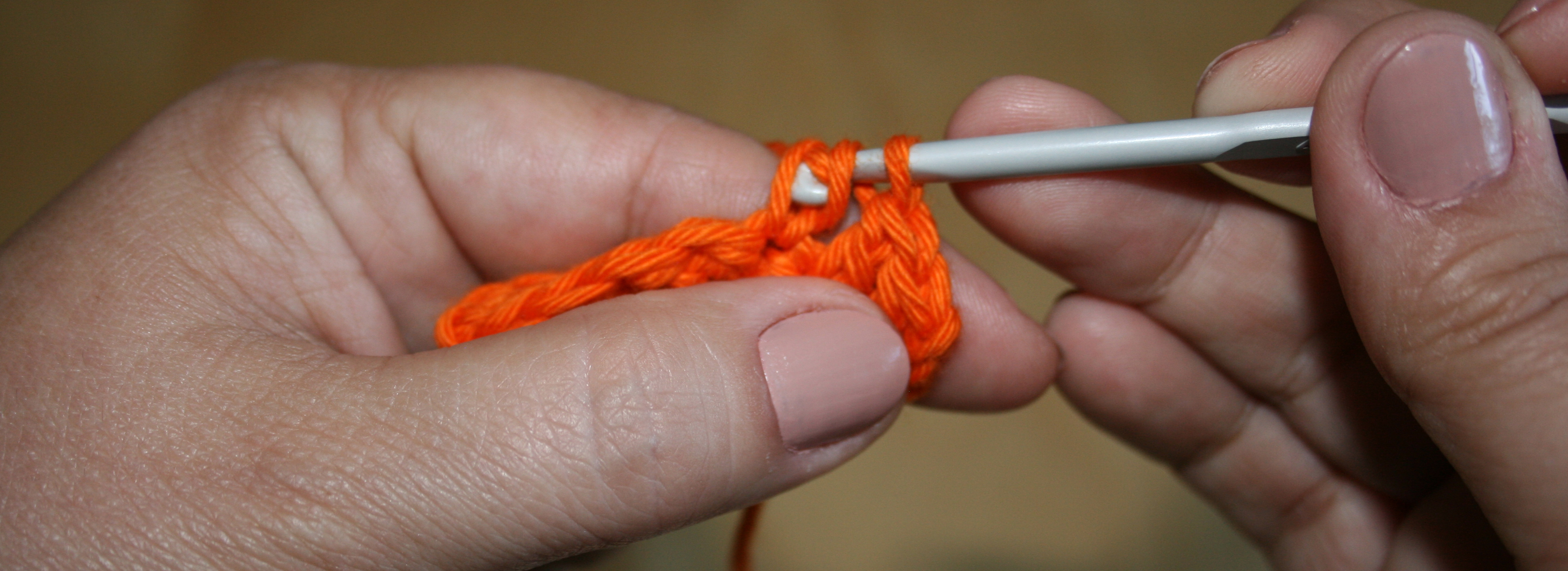 close up on a hand crocheting